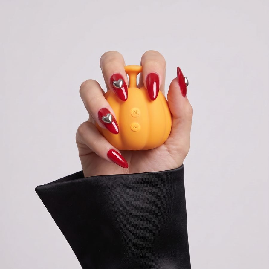 Jack in a hand with red nails